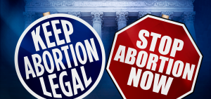 Signs argue both sides of the abortion debate