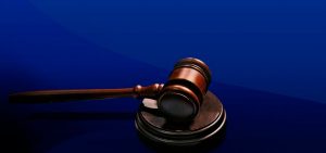 graphic of a gavel on a blue background
