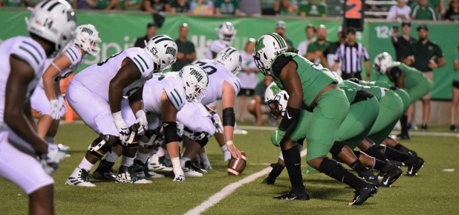 The Ohio University Bobcats line up for a snap against the Marshall Thundering Herd