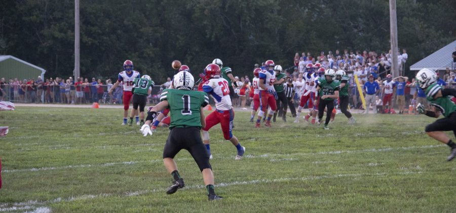 Waterford player watches Fort Frye player receive a pass