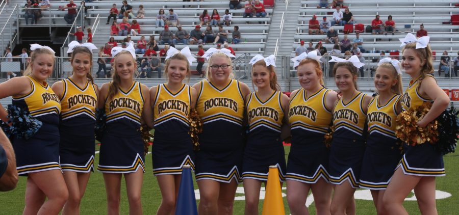 Wellston cheerleaders pose for picture before the last Wellston-Jackson rivalry game.