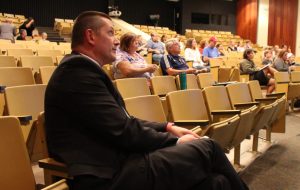 Superintendent Tom Gibbs sits in the crowd at a recent Athens City School District Board of Education meeting.