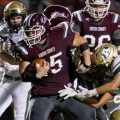 Vinton County senior Logan Baker fights through the defense during the game at Vinton County against Athens High School on Sept. 27, 2019