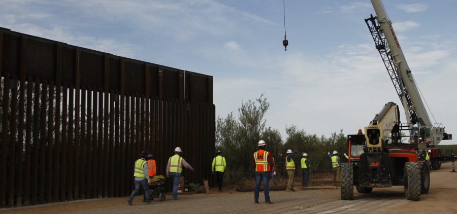 Workers break ground on new border wall construction about 20 miles west of Santa Teresa, N.M., last month. The Trump administration has started the arduous process of canceling $3.6 billion in military construction projects to fund its plans to build more of a wall along the U.S.-Mexico border.