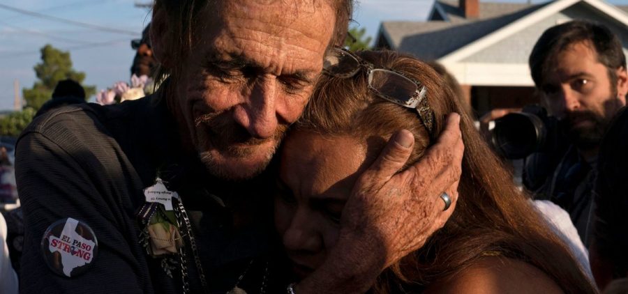 Antonio Basco, husband of El Paso Walmart shooting victim Margie Reckard, hugs an attendee during his wife's visitation service in El Paso, Texas, in August.