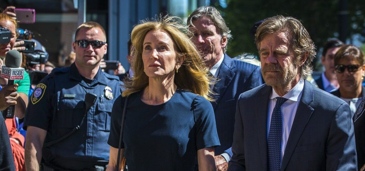 Actress Felicity Huffman and her husband, actor William H. Macy, arrive for her sentencing hearing Friday at the John Joseph Moakley United States Courthouse in Boston.
