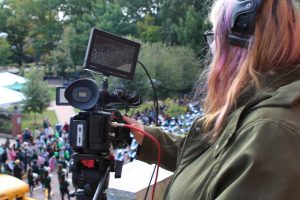 Rhyann Green runs camera for Homecoming Parade