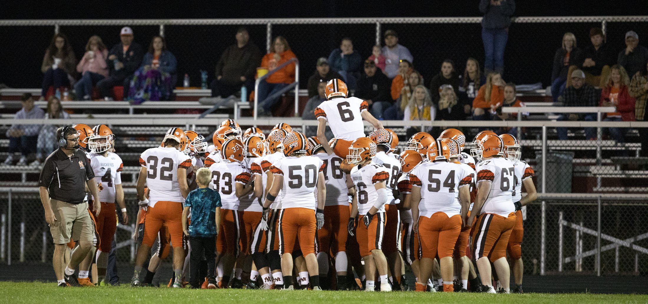 Nelsonville-York High Schools Christopher McDonald (6) is hoisted up by his team a game between Nelsonville-York and Meigs on Oct. 4, 2019 at Meigs High School in Pomeroy, Ohio. PHOTO: Charles Hatcher/WOUB