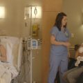 family in delivery room after having baby