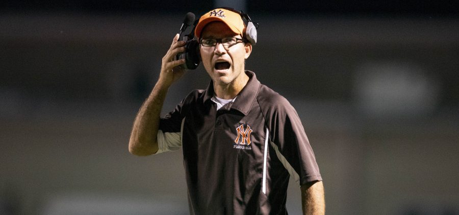 Nelsonville-York head coach Rusty Richards yells to his players during the game against River Valley on Sept. 20, 2019.
