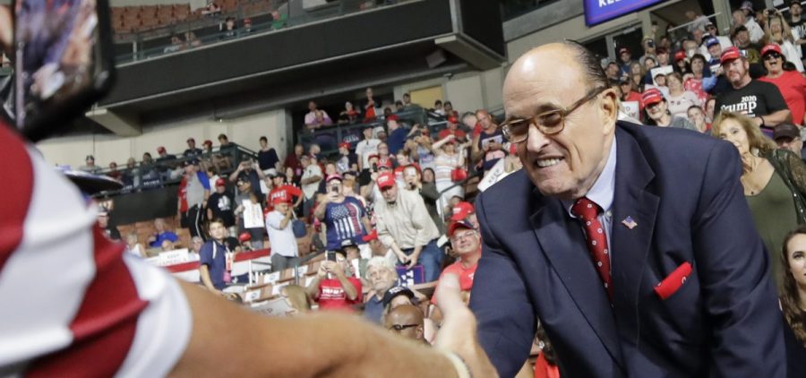 Former New York City Mayor Rudy Giuliani shook hands with supporters as he arrived at President Trump's campaign rally on Aug. 15, 2019, in Manchester, N.H.