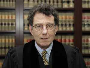 The man overseeing the multidistrict litigation: U.S. District Judge Dan Polster, seen in this undated photo in his Cleveland office.