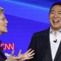 Sen. Elizabeth Warren, D-Mass., and entrepreneur Andrew Yang talk during a break in the Democratic presidential primary debate hosted by CNN/New York Times.