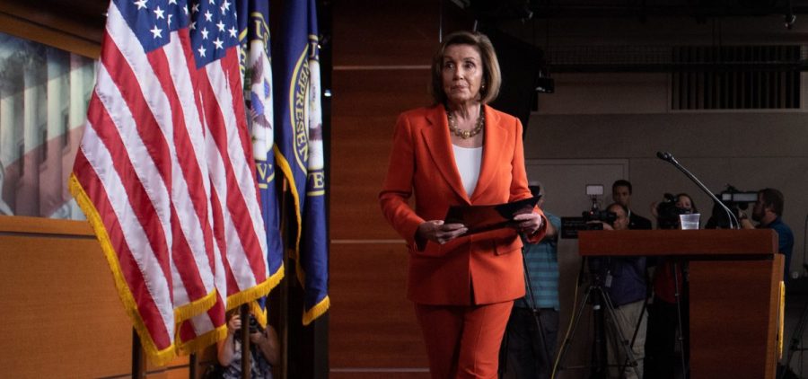 Speaker of the House Nancy Pelosi, D-Calif., leaves after speaking at her weekly press conference on Capitol Hill on Thursday as the House prepared to vote — then pass — a resolution formalizing its impeachment inquiry into President Trump.