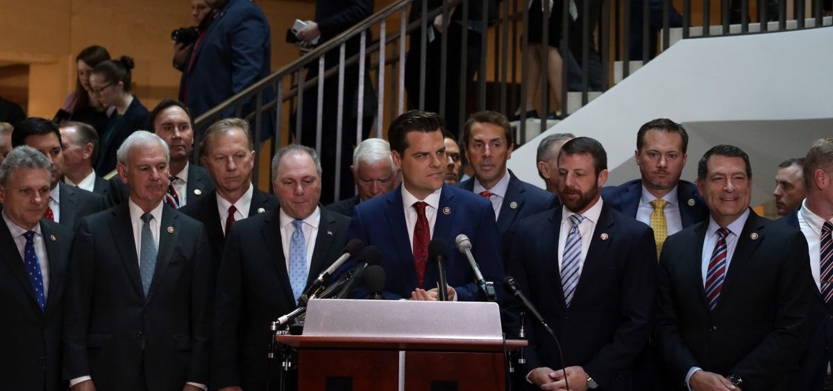 Flanked by about two dozen House Republicans, U.S. Rep. Matt Gaetz, R-Fla., argues that all GOP lawmakers should have access to closed-door depositions in the impeachment inquiry. Committee rules dictate that only those on the panels conducting the probe can attend.