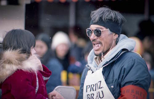 dog musher smiling at race event