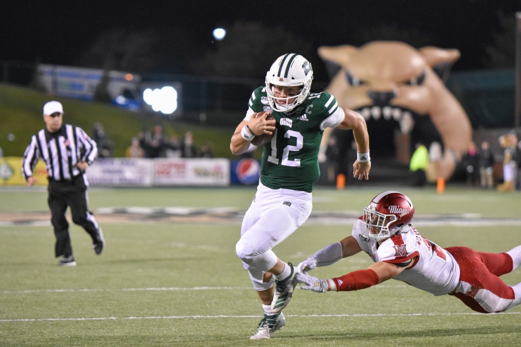 Nathan Rourke (12) runs past a Miami defender for a touchdown during the Bobcats' 24-21 loss to Miami on November 6, 2019. [Ben Weilgopolski | WOUB]