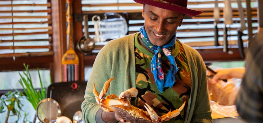 Chef Marcus Samuelsson prepares a crab for a ginataang alimasag