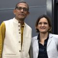 Esther Duflo, left, and Abhijit Banerjee stand together following a news conference at Massachusetts Institute of Technology in Cambridge, Mass., Monday, Oct. 14, 2019.