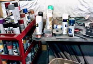 Spray paints in the Back’s workshop.