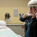 The first U.S. case of COVID-19 was treated at Providence Regional Medical Center in Everett, Washington. Robin Addison, a nurse there, demonstrates how she wears a respirator helmet with a face shield intended to prevent infection.