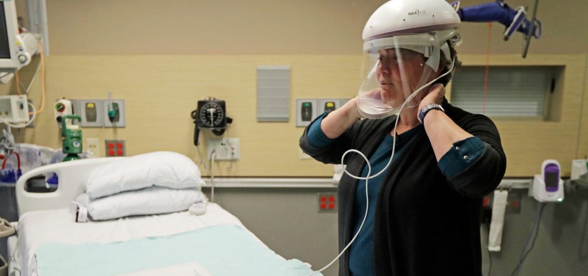 The first U.S. case of COVID-19 was treated at Providence Regional Medical Center in Everett, Washington. Robin Addison, a nurse there, demonstrates how she wears a respirator helmet with a face shield intended to prevent infection.