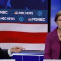 Democratic presidential candidate Sen. Elizabeth Warren, D-Mass., gestures during the debate, as fellow candidate, former New York Mayor Mike Bloomberg, looks on.