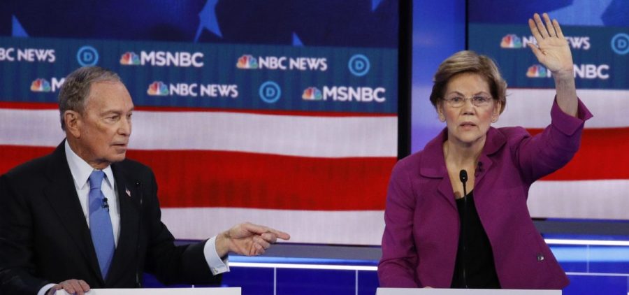 Democratic presidential candidate Sen. Elizabeth Warren, D-Mass., gestures during the debate, as fellow candidate, former New York Mayor Mike Bloomberg, looks on.