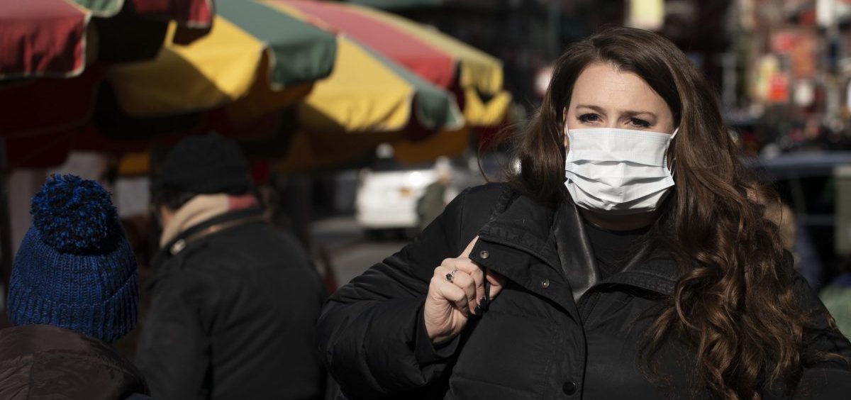 A woman, who declined to give her name, wears a mask in New York out of concern for the newly emerged coronavirus.
