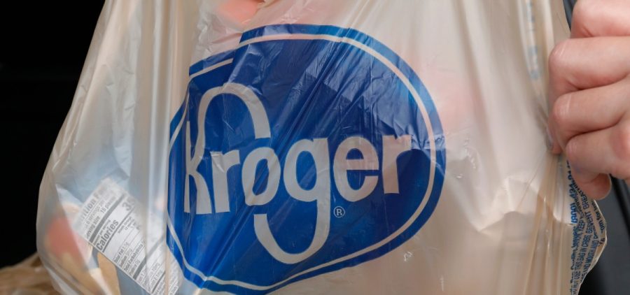A customer removes her purchases at a Kroger grocery store in Flowood, Miss., Wednesday, June 26, 2019.