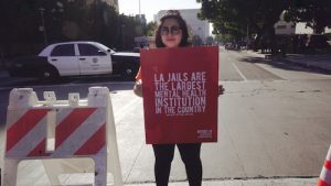 Protester in downtown Los Angeles, opposing construction of a new jail to house the mentally ill