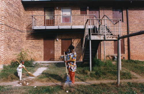 Rilene and Chasity Dixon clean up the lawn in front of their East Lake Meadows apartment. Atlanta, GA. October 28, 1992.