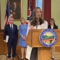Ohio Department of Health Director Dr. Amy Acton speaks at a news conference, as Lt. Gov. Jon Husted, Gov. Mike DeWIne and First Lady Fran Dewine and Commerce Director Sherry Maxfield look on. A sign language interpreter is present at these events.