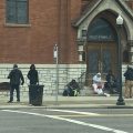 People gather outside Holy Family Church in Columbus, which does outreach to the homeless in Franklin County.