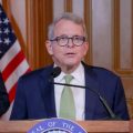 Gov. Mike DeWine speaks at his daily coronavirus press conference on March 20. Behind him are Lt. Gov. Jon Husted and Ohio Department of Health Director Dr. Amy Acton.