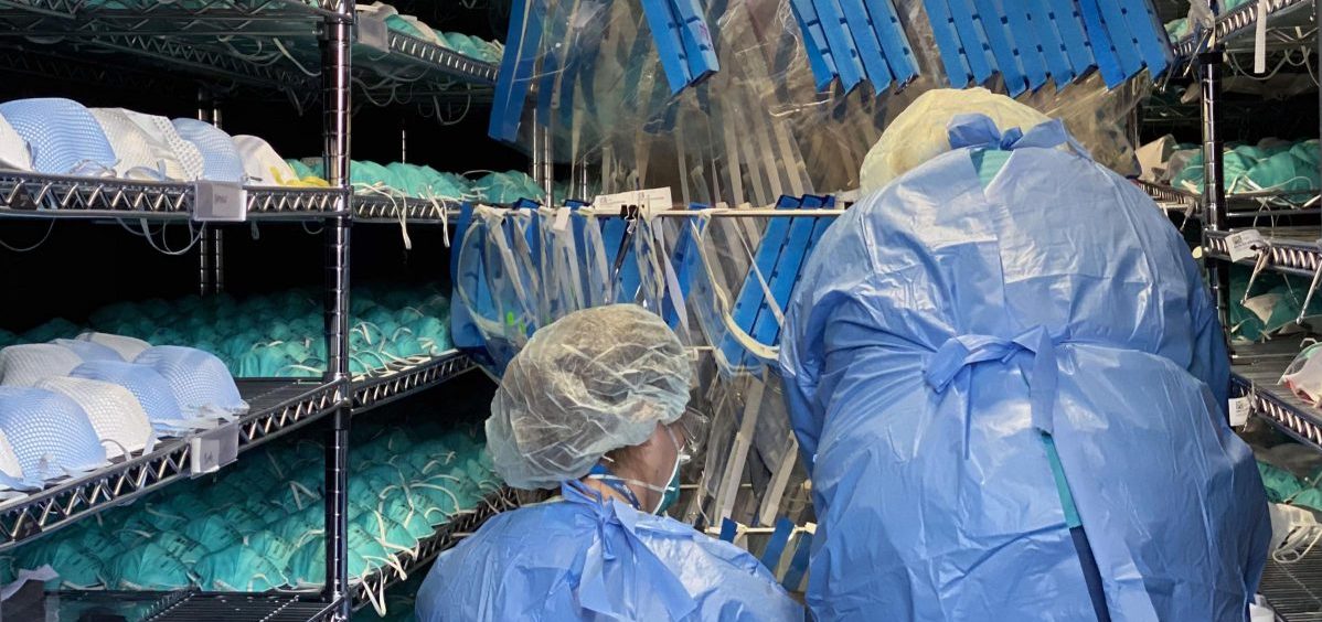 Battelle employees process N-95 masks in the Critical Care Decontamination System.