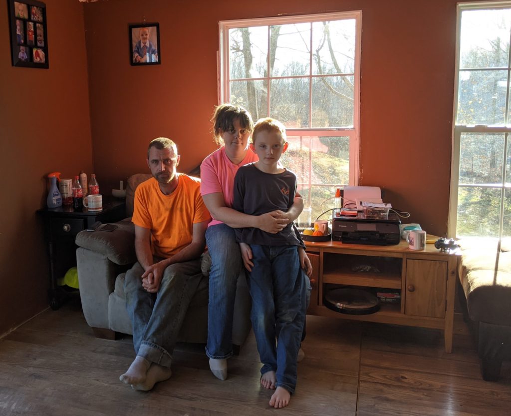 The Easterling family, Chauncy, Melissa and Timothy, in their living room.