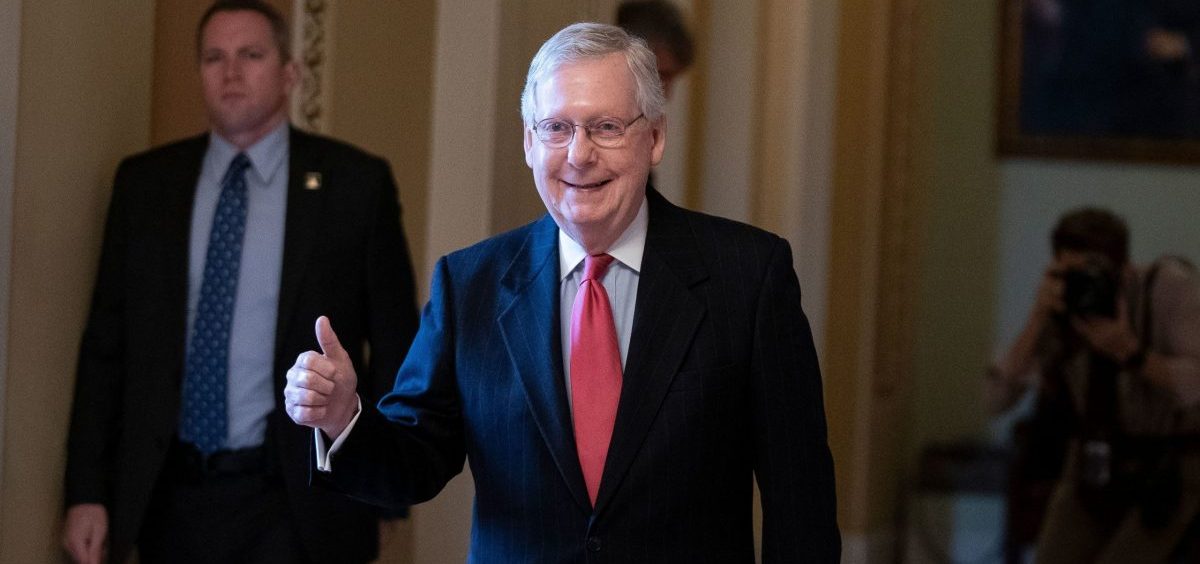 Senate Majority Leader Mitch McConnell leaves the Senate floor on Wednesday as the U.S. Senate was poised to pass a massive relief package for Americans and businesses ravaged by the coronavirus pandemic.