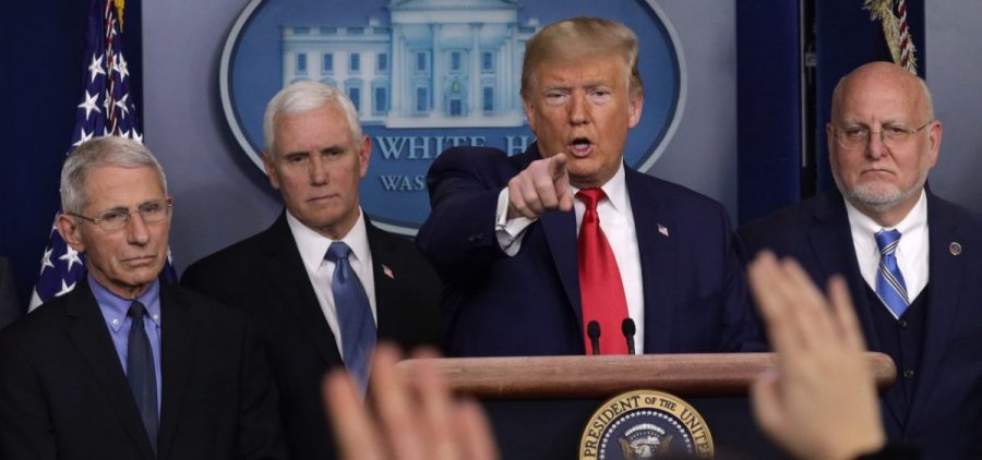 President Trump takes questions at a press conference with, from left, National Institute for Allergy and Infectious Diseases Director Anthony Fauci, Vice President Mike Pence and Centers for Disease Control and Prevention Director Robert Redfield.