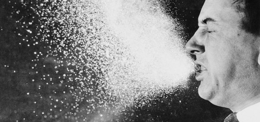 A photograph from 1940, taken for infectious research purposes at the Massachusetts Institute of Technology, shows respiratory droplets released through sneezing.