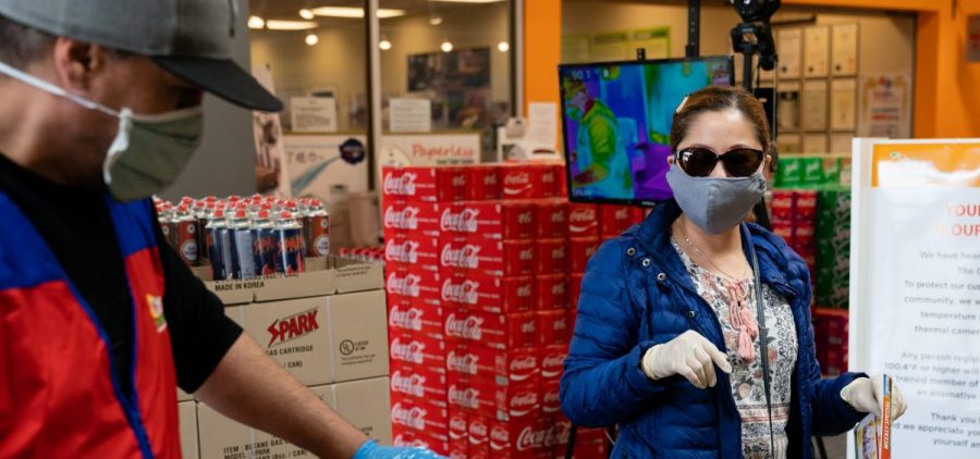 Even without symptoms, you might have the virus and be able to spread it when out in public, say researchers who now are reconsidering the use of surgical masks.
