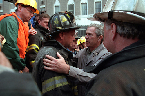 President George W. Bush embraces a firefighter at the site of the World Trade Center