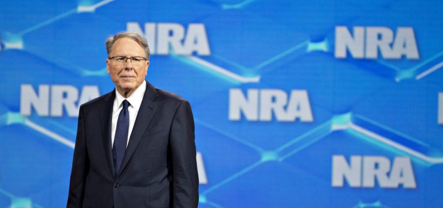 Wayne LaPierre, CEO of the National Rifle Association, stands onstage during the NRA's annual meeting in Indianapolis on April 26, 2019.