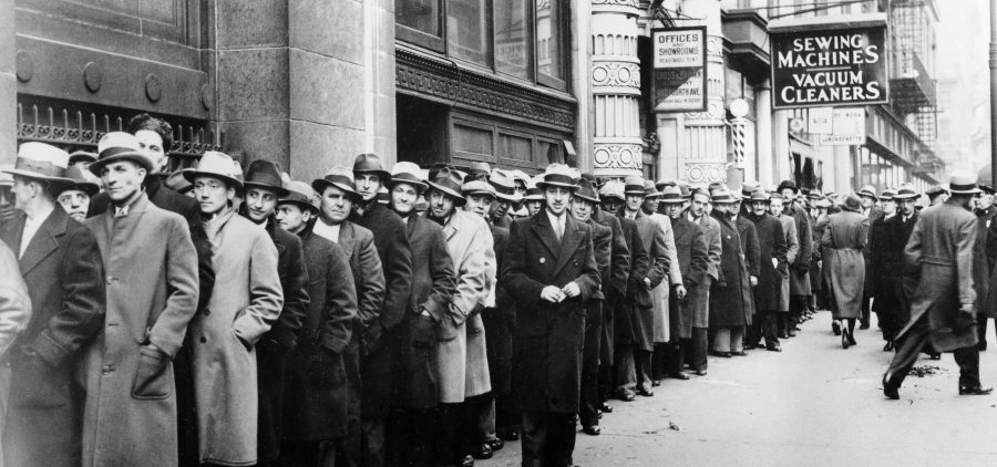 Unemployed people wait outside the state Labor Bureau in New York City in 1933. The current economic crisis has drawn comparisons to the Great Depression, but experts say this downturn should be shorter.