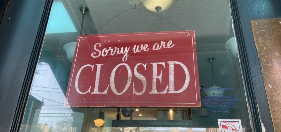 A closed sign in a store near downtown Columbus