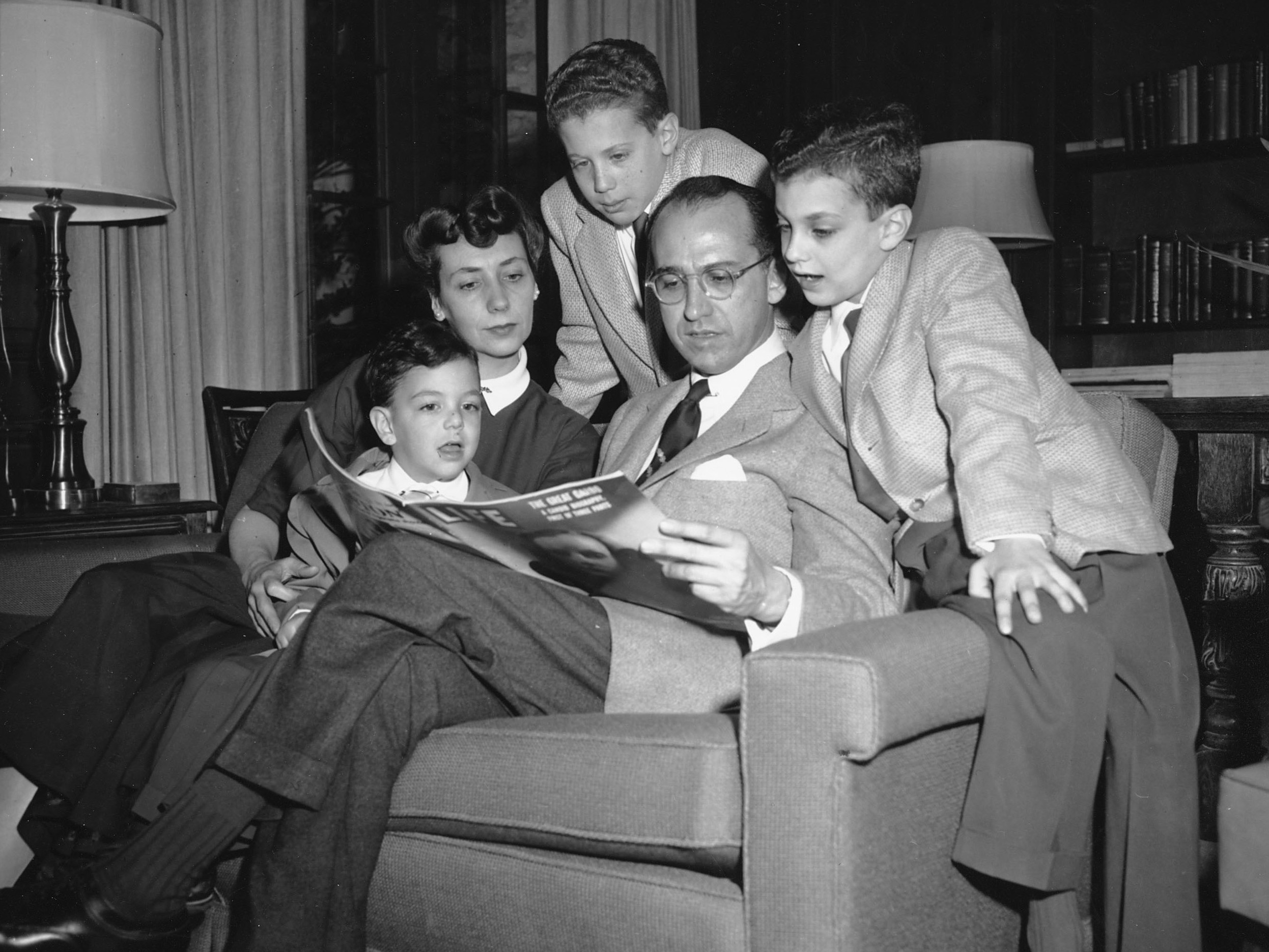 Dr. Jonas E. Salk, who discovered the polio vaccine, reads with his wife and three boys in Ann Arbor, Mich., on April 11, 1955. The boys were among the first vaccinated during testing. The family was photographed the night before an announcement the vaccine was effective. Pictured from left are Jonathan, 5; Donna Salk; Peter, 11; Salk; and Darrell, 8.