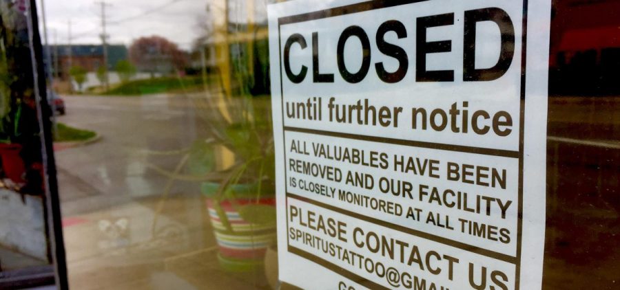 Spiritus Tattoo, a tattoo parlor in Clintonville, is closed as a non-essential business. A sign posted on the storefront window cautions would-be criminals that all valuables have been removed.