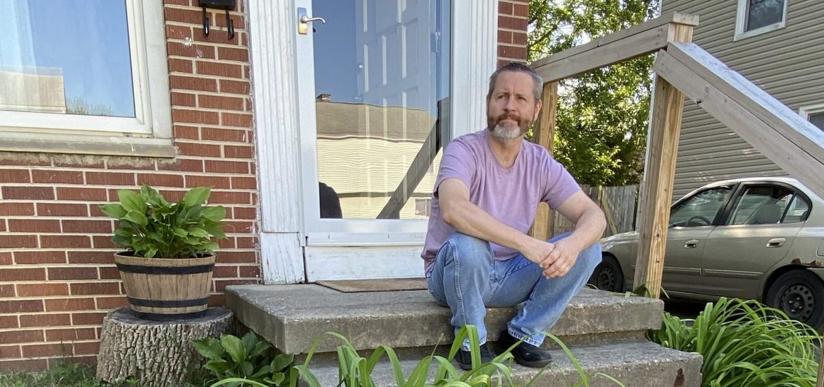 Rodney Sweigert outside his home in Columbus. The single father still hasn't received unemployment insurance for three months and sells plasma to scrape by.