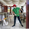 A cafe employee in Washington, D.C., cleans in preparation for reopening.
