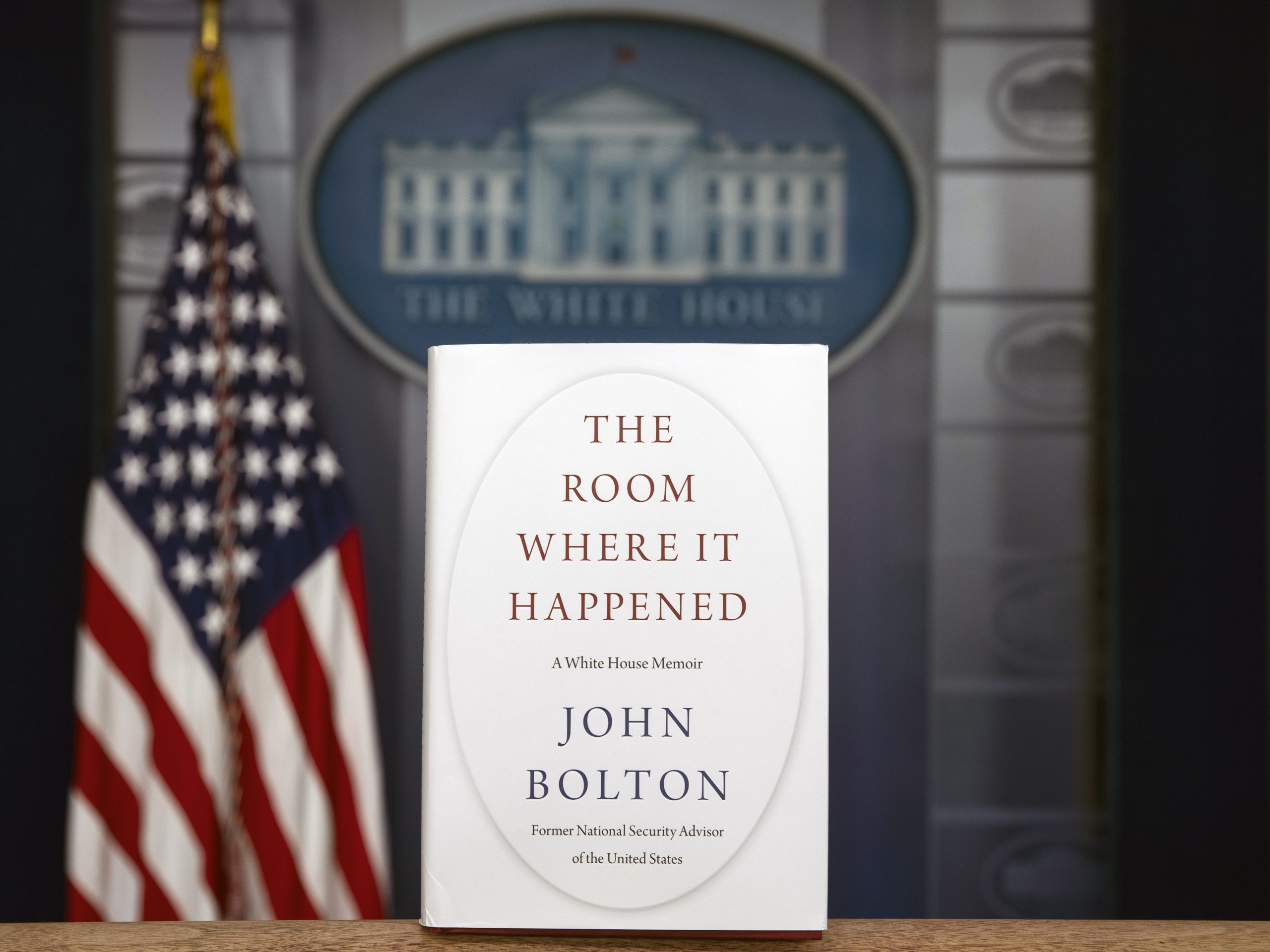 A copy of John Bolton's new book, The Room Where It Happened, stands in the White House briefing room. On Saturday, a federal judge declined the Trump administration's request to block the publication of the former national security adviser's book.
